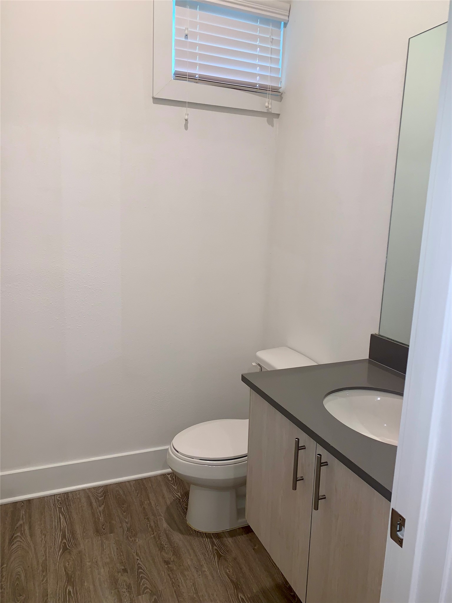 10209 Las Nubes Avenue Houston, TX 77075 - Photo 10 of 29 a bathroom with a granite countertop toilet and sink