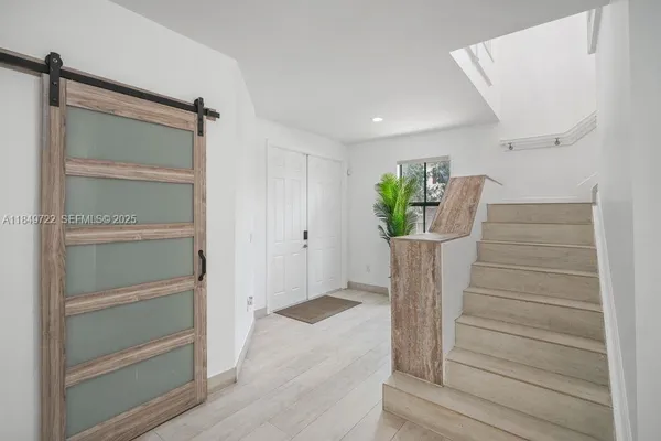 a view of entryway with wooden floor