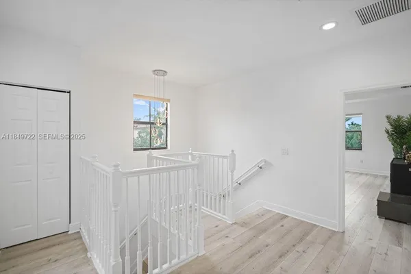 a view of entryway with wooden floor