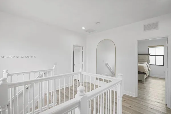 a view of entryway with wooden floor
