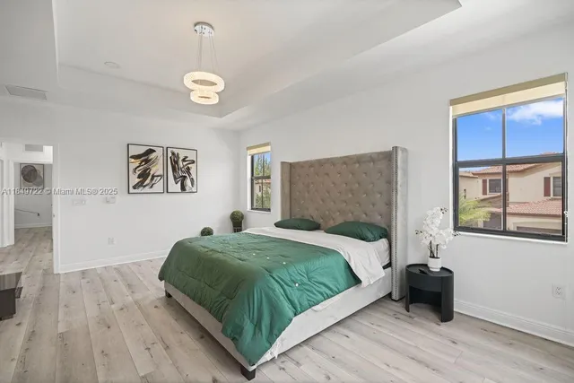 a bedroom with a bed and a couch