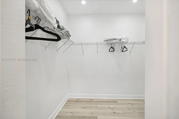 a view of a room with racks on the wall