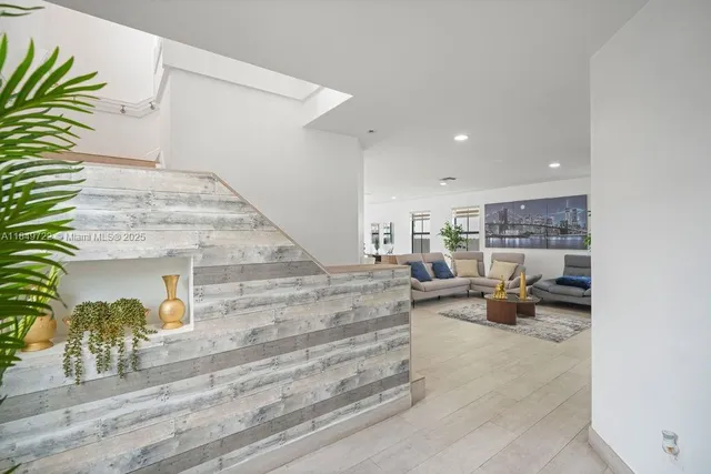 a view of entryway with livingroom and wooden floor