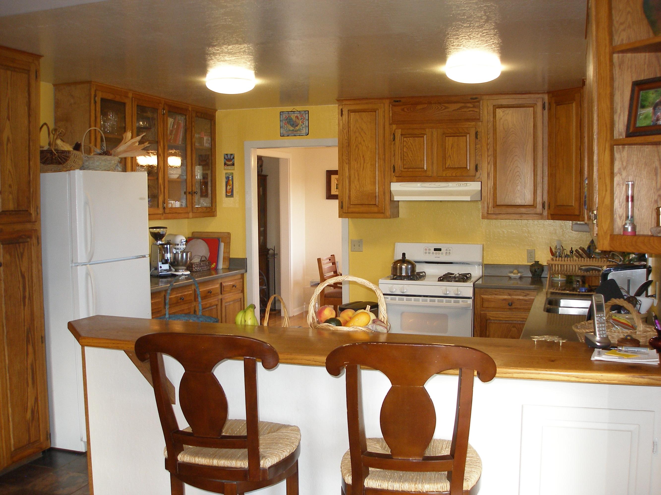 32135 Rock Creek Road Manton, CA 96059 - Photo 16 of 65 a kitchen with refrigerator a stove a sink and chairs