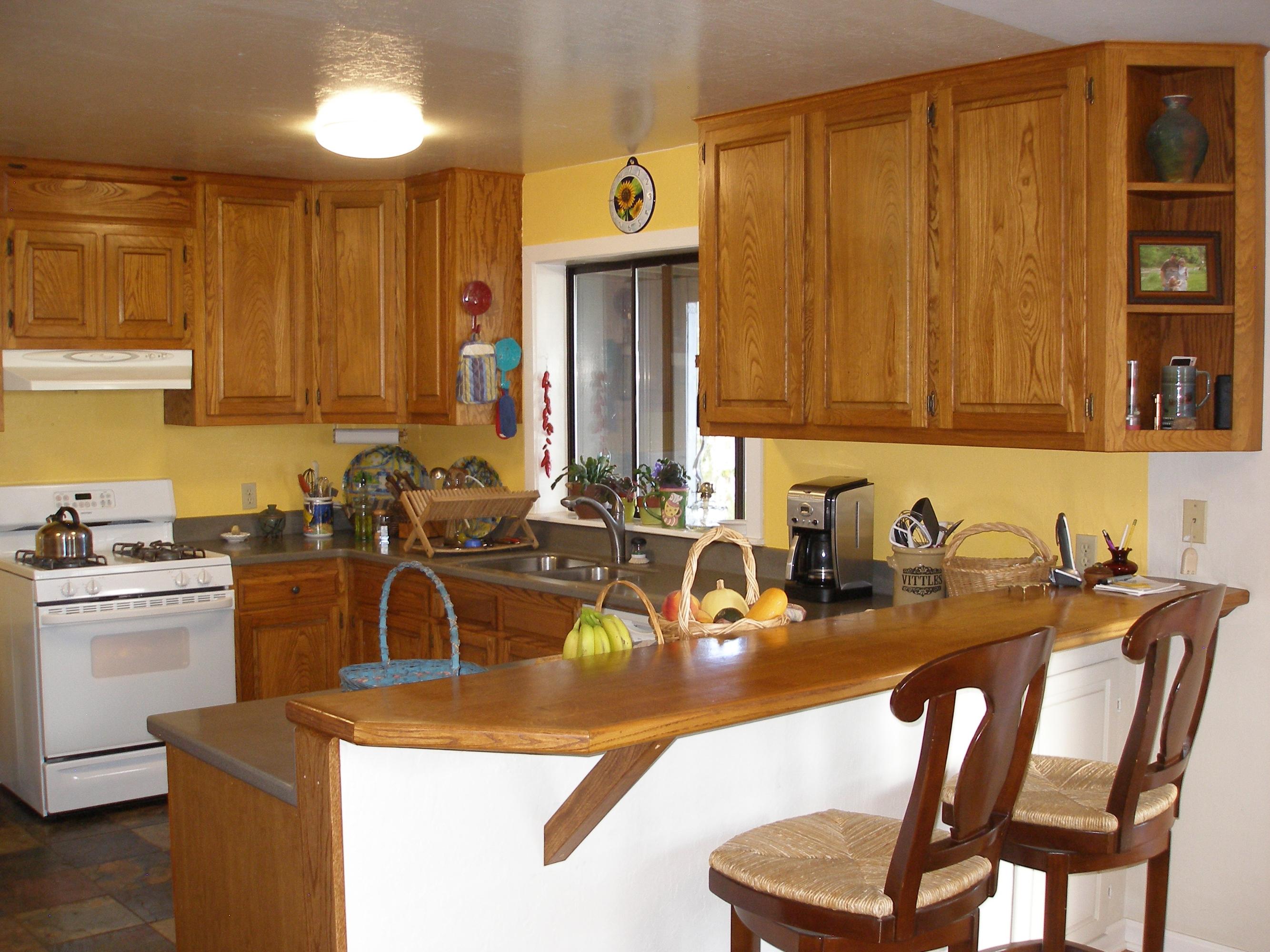 32135 Rock Creek Road Manton, CA 96059 - Photo 17 of 65 a kitchen with a sink a stove and chairs
