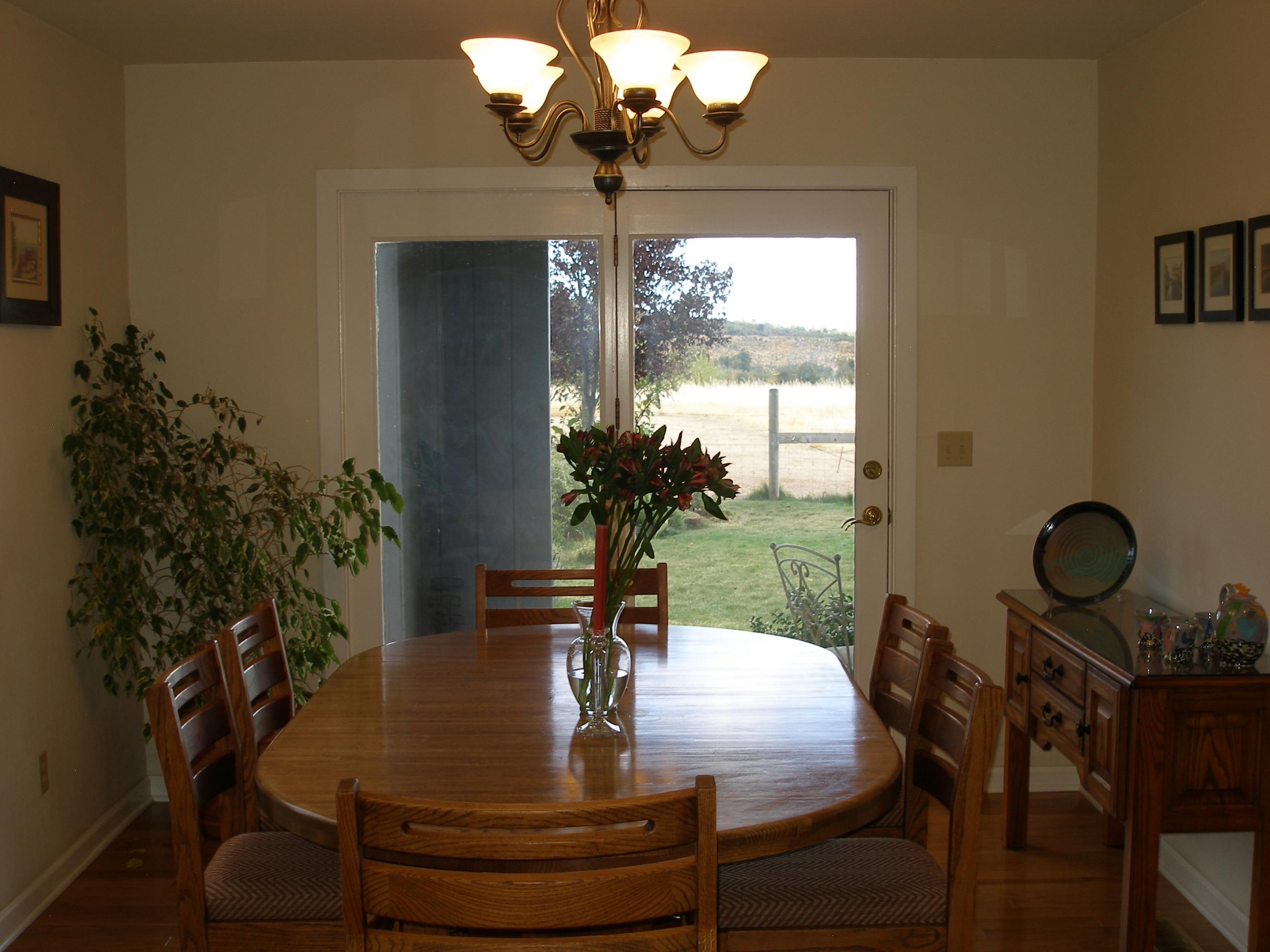 32135 Rock Creek Road Manton, CA 96059 - Photo 26 of 65 a view of a dining room with furniture wooden floor and chandelier
