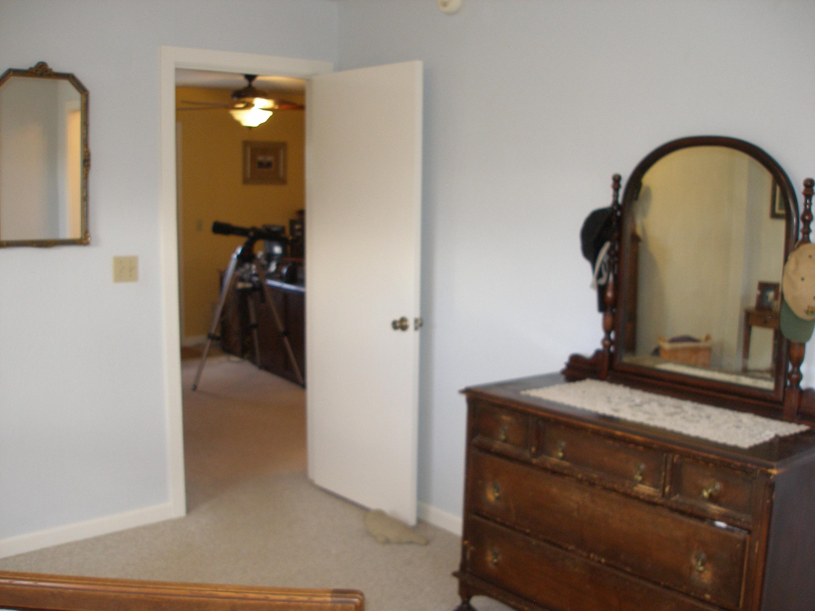 32135 Rock Creek Road Manton, CA 96059 - Photo 33 of 65 a bedroom with a bed and a mirror