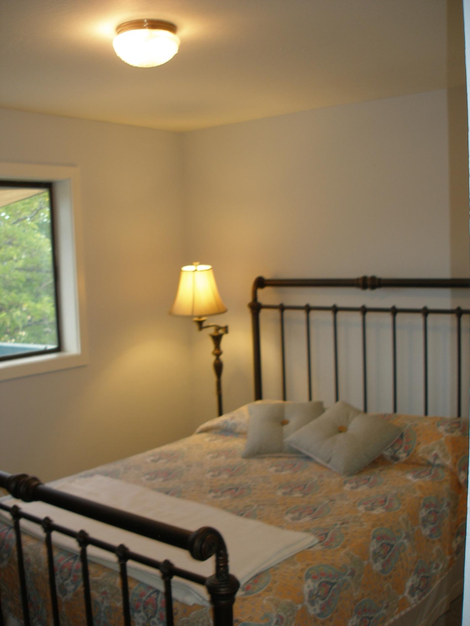 32135 Rock Creek Road Manton, CA 96059 - Photo 35 of 65 a bed sitting in a bedroom next to a window