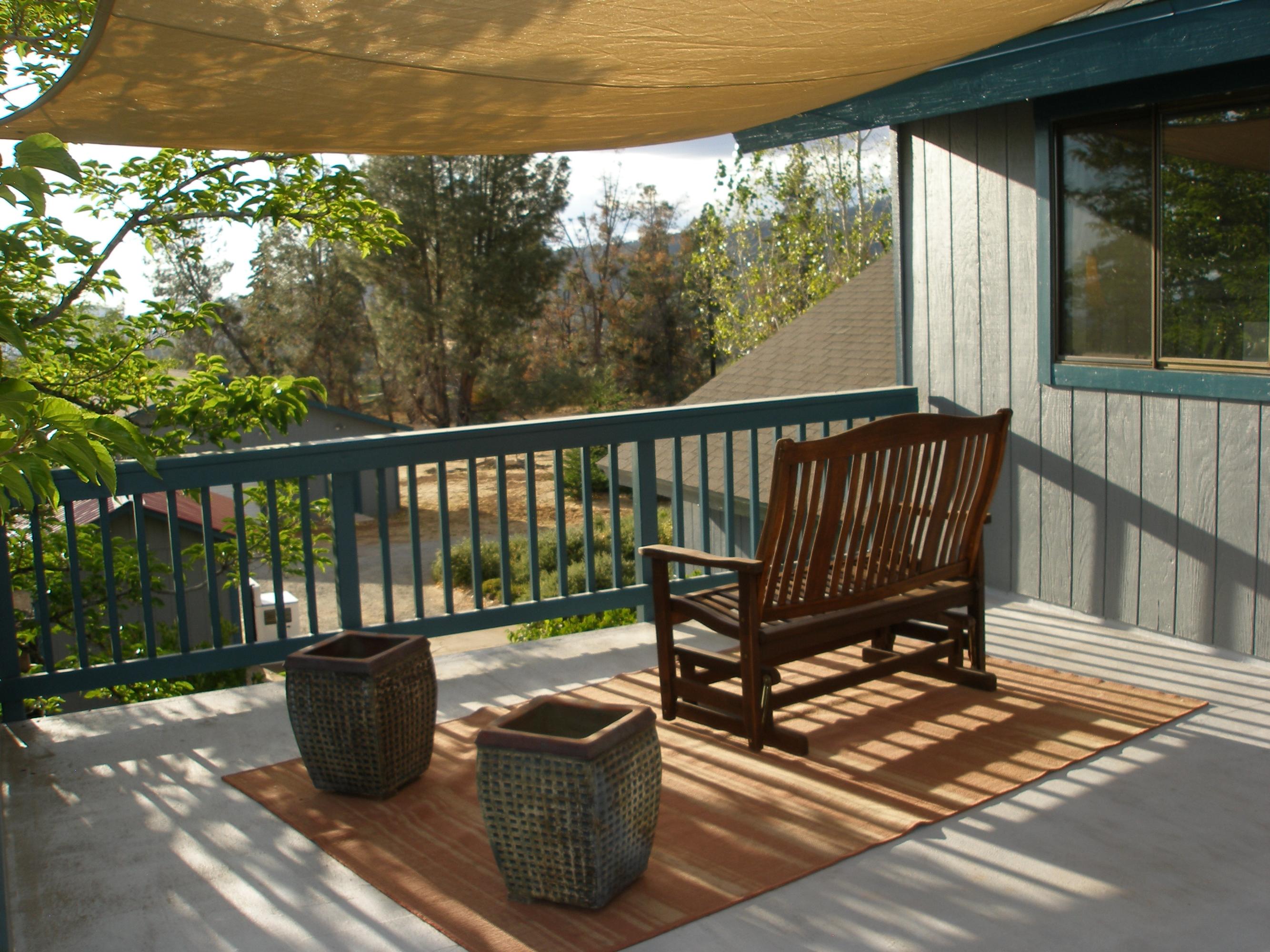 32135 Rock Creek Road Manton, CA 96059 - Photo 48 of 65 a view of balcony with wooden floor and outdoor seating