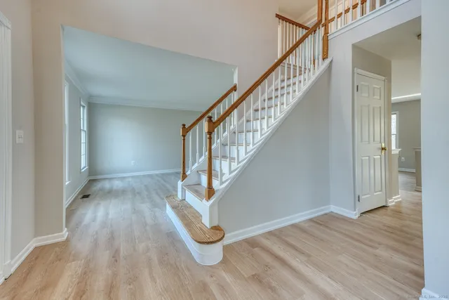 a view of entryway with wooden floor