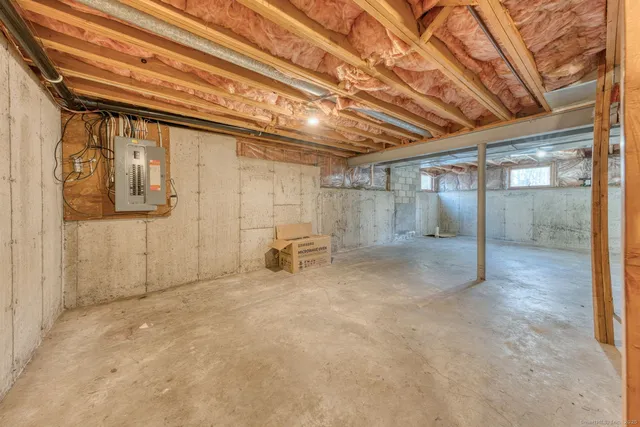 a view of empty room with wooden ceiling