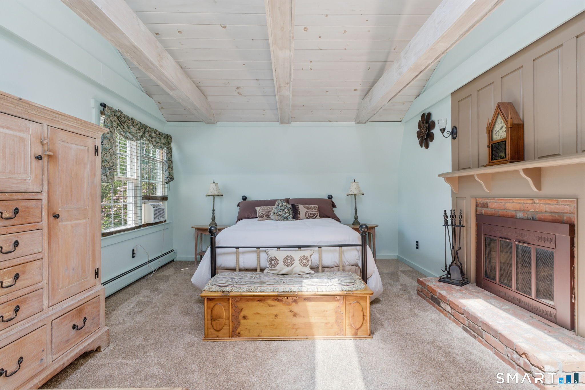 79 Buckboard Lane Bristol, CT 06010 - Photo 29 of 40 a bedroom with a bed and a fireplace