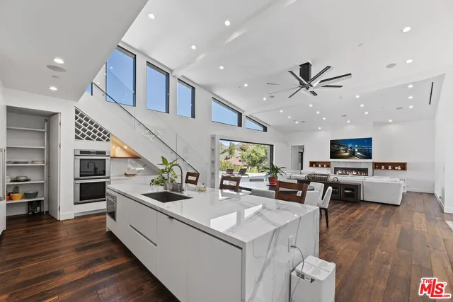 a view of a patio with table and chairs