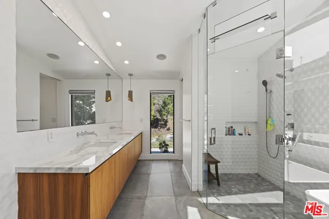 a aerial view of a house with a mountain