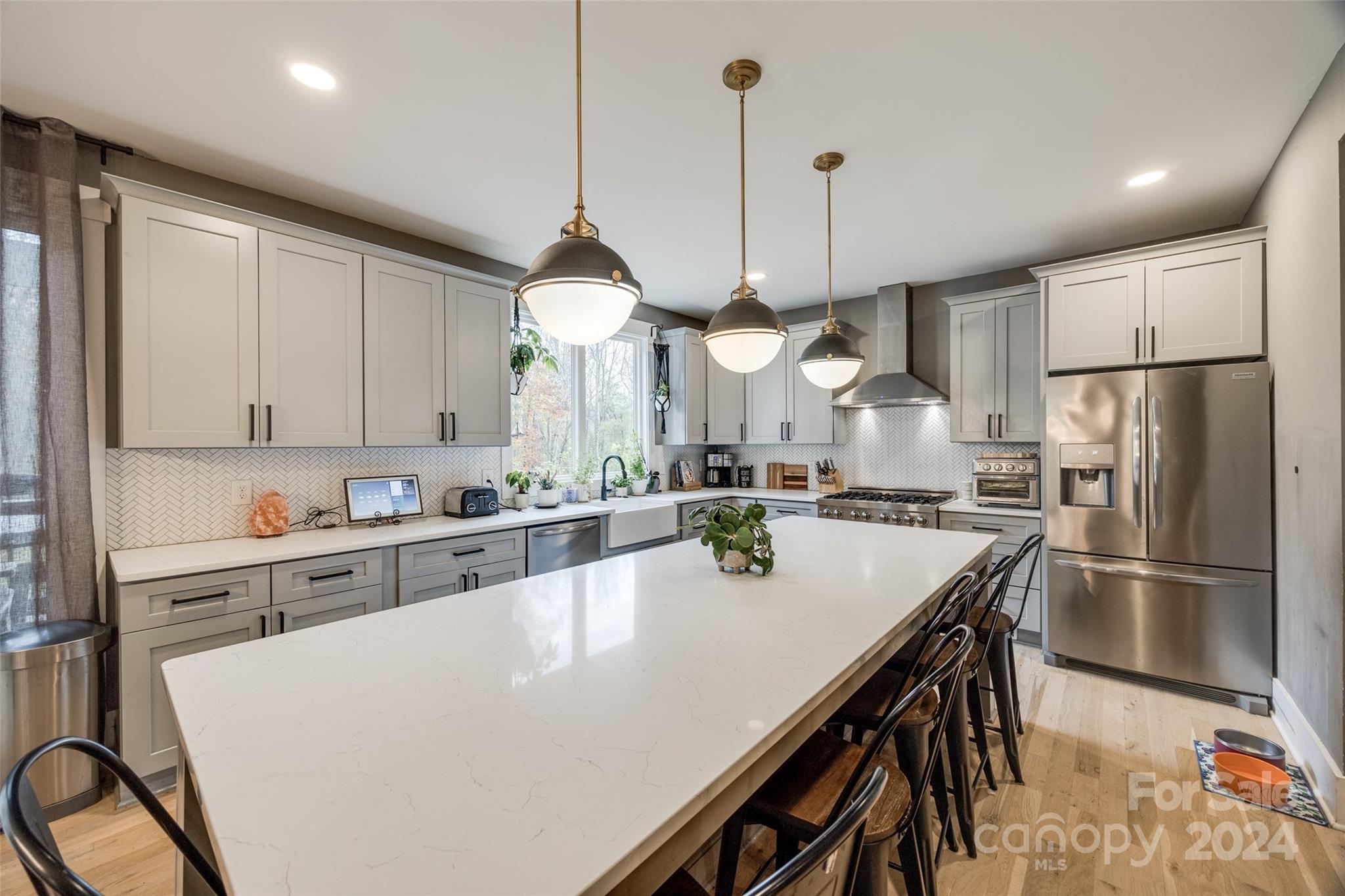 785 Ormand Road York, SC 29745 - Photo 12 of 46 a kitchen with kitchen island a stove a sink a center island and cabinets