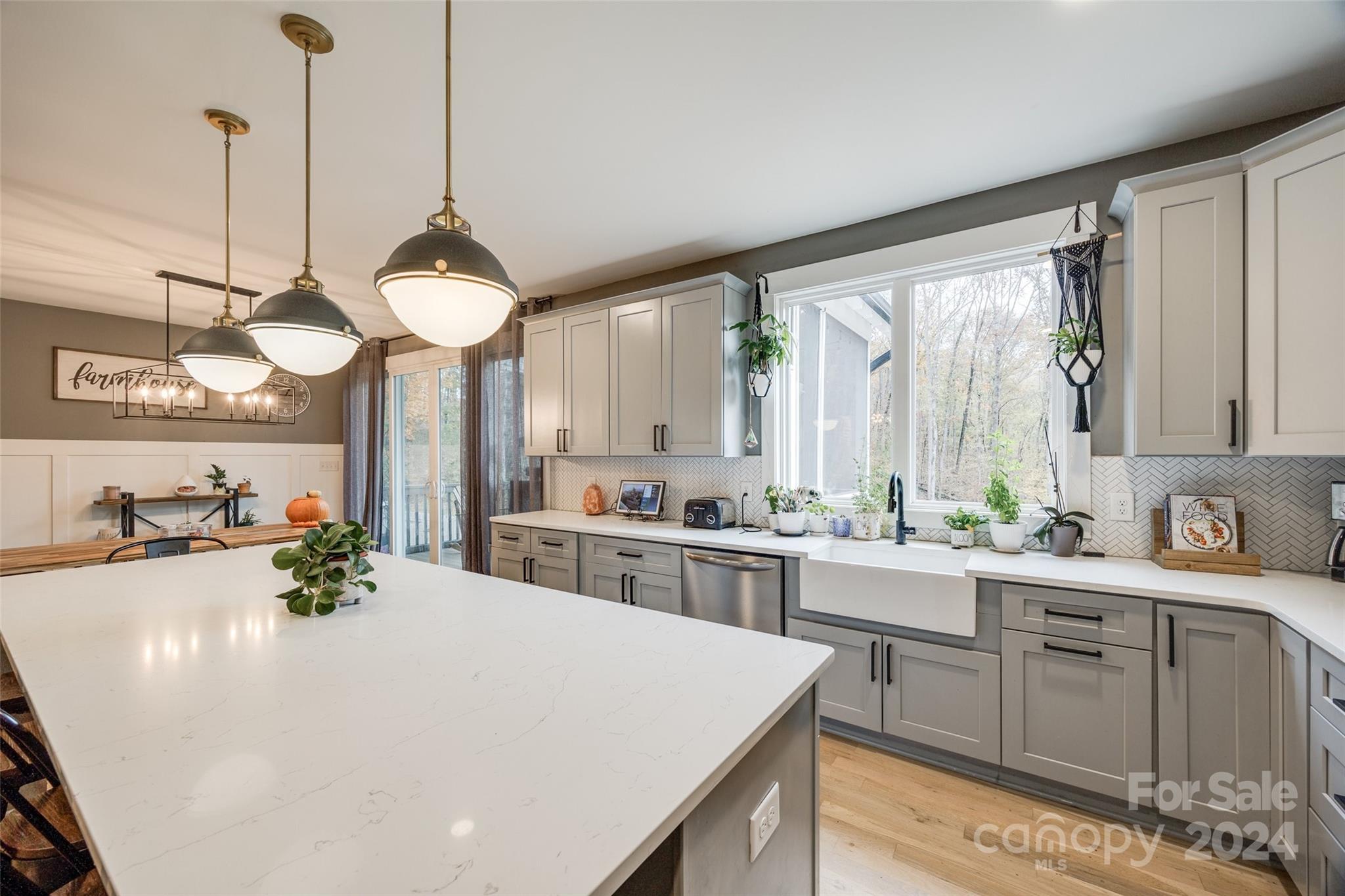 785 Ormand Road York, SC 29745 - Photo 14 of 46 a kitchen with a stove a sink a center island and cabinets