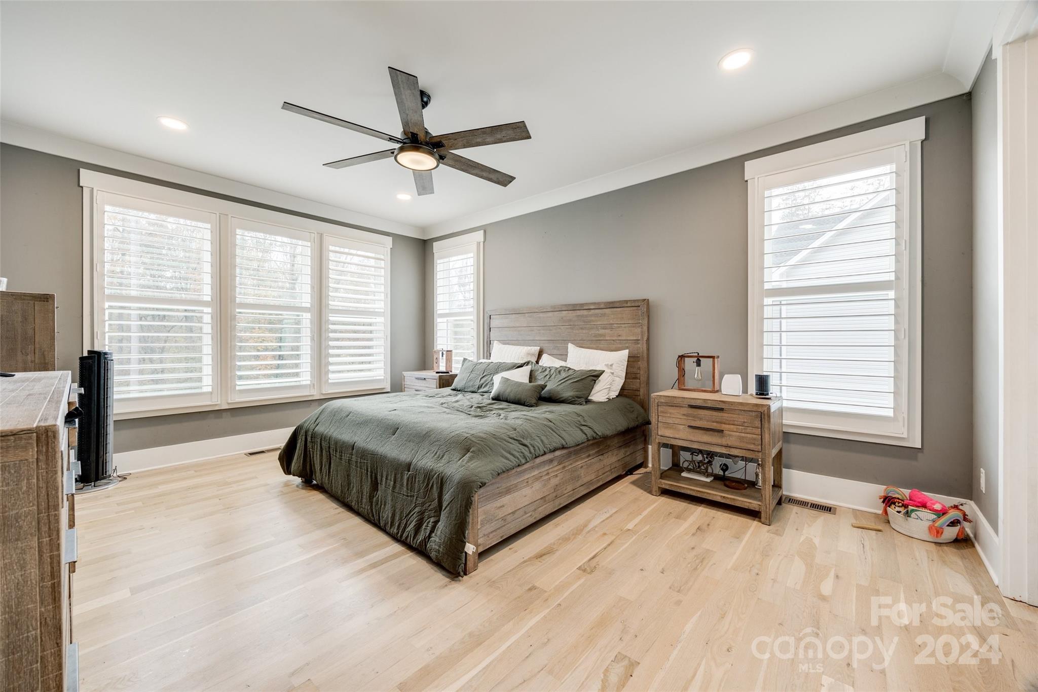 785 Ormand Road York, SC 29745 - Photo 17 of 46 a spacious bedroom with a bed a dresser and a large window