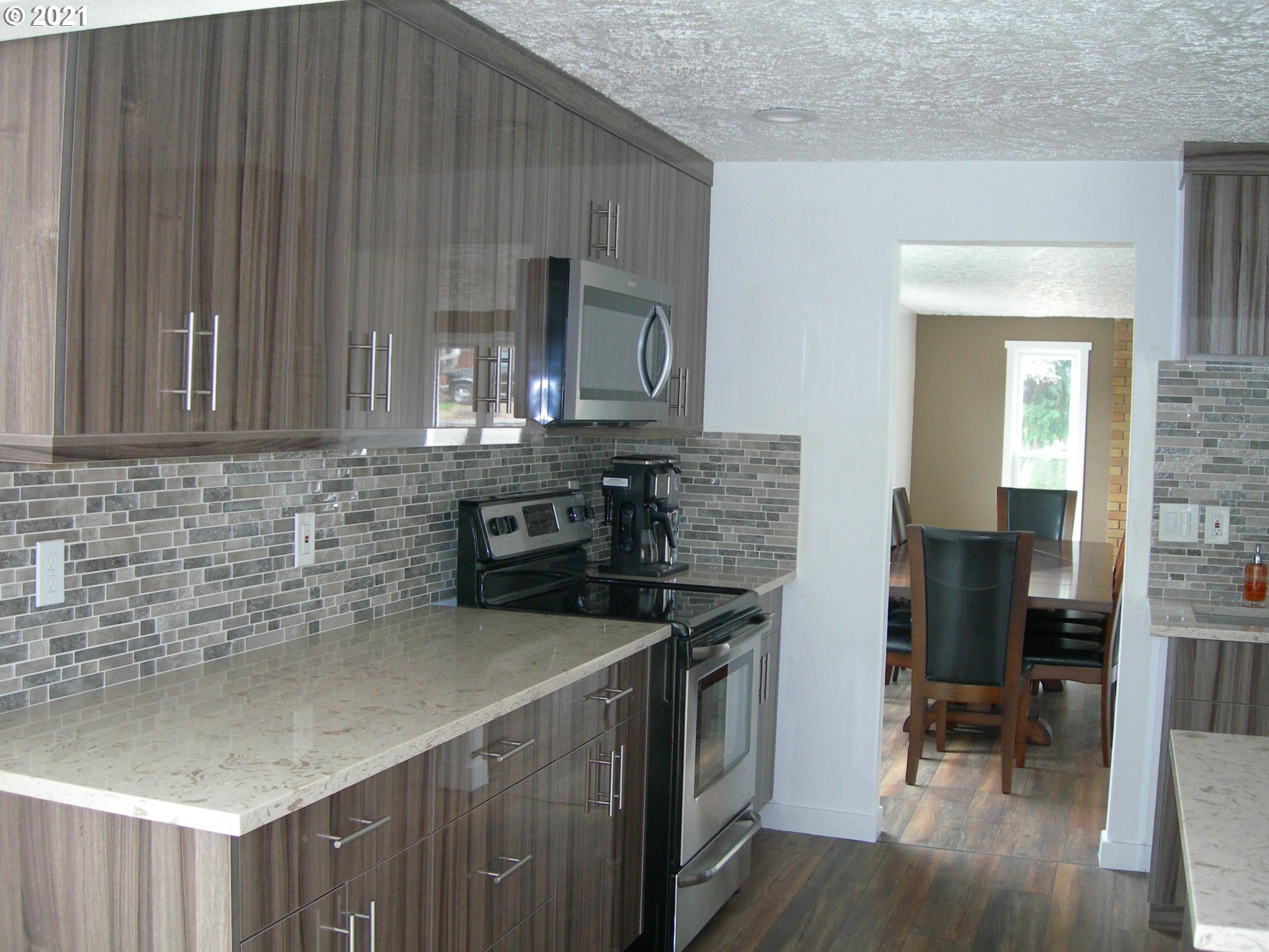 3310 Northeast 162nd Street Ridgefield, WA 98642 - Photo 5 of 13 a kitchen with a sink cabinets and wooden floor