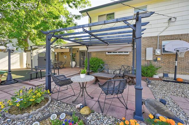 1012 North Chelton Road Colorado Springs, CO 80909 - Photo 12 of 46 View of patio / terrace featuring a pergola and outdoor dining area