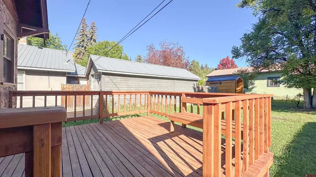 a view of balcony with wooden floor and outdoor seating