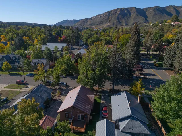 an aerial view of a house with a garden