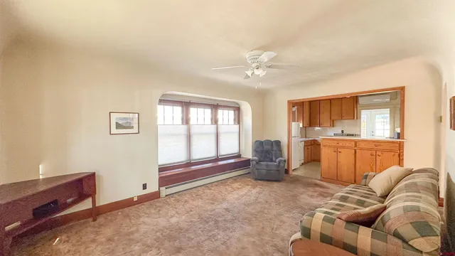 a living room with furniture and a area