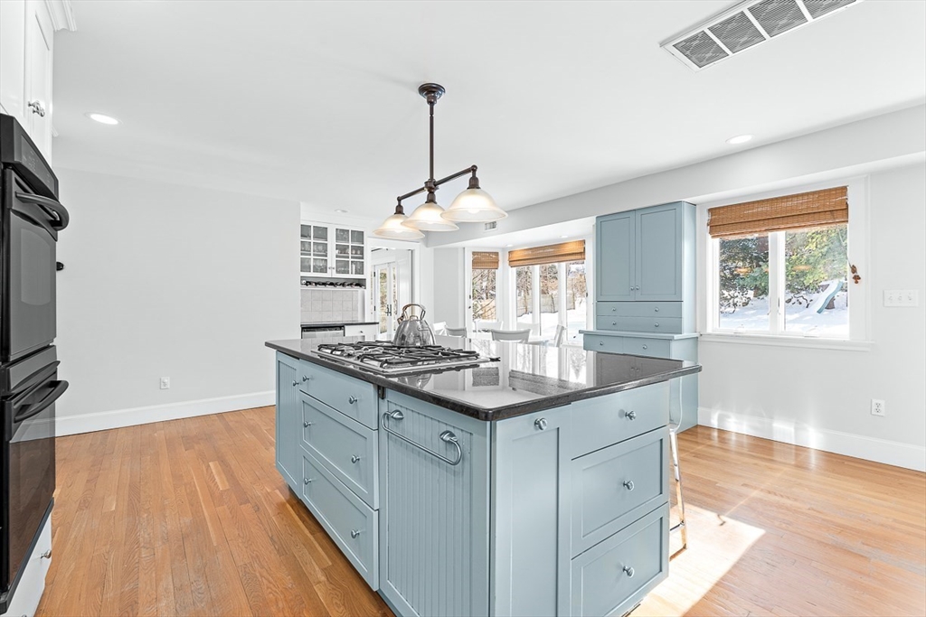 23 Jefferson Road Winchester, MA 01890 - Photo 12 of 41 a kitchen with a sink and wooden floor