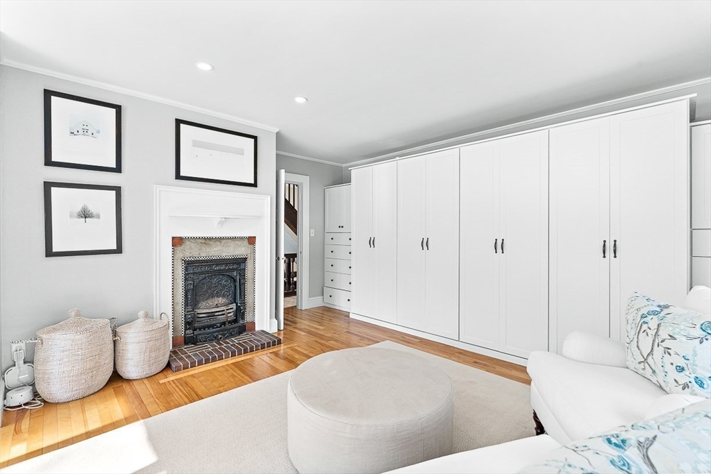 23 Jefferson Road Winchester, MA 01890 - Photo 20 of 41 a living room with furniture and a fireplace