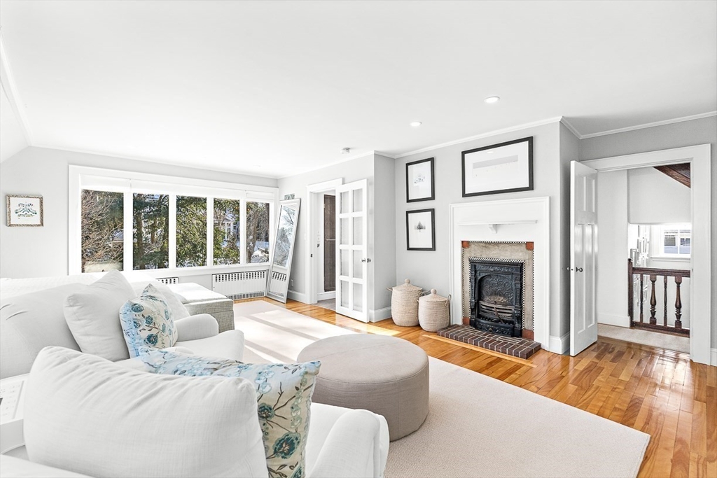 23 Jefferson Road Winchester, MA 01890 - Photo 21 of 41 a bedroom with a bed and a fireplace