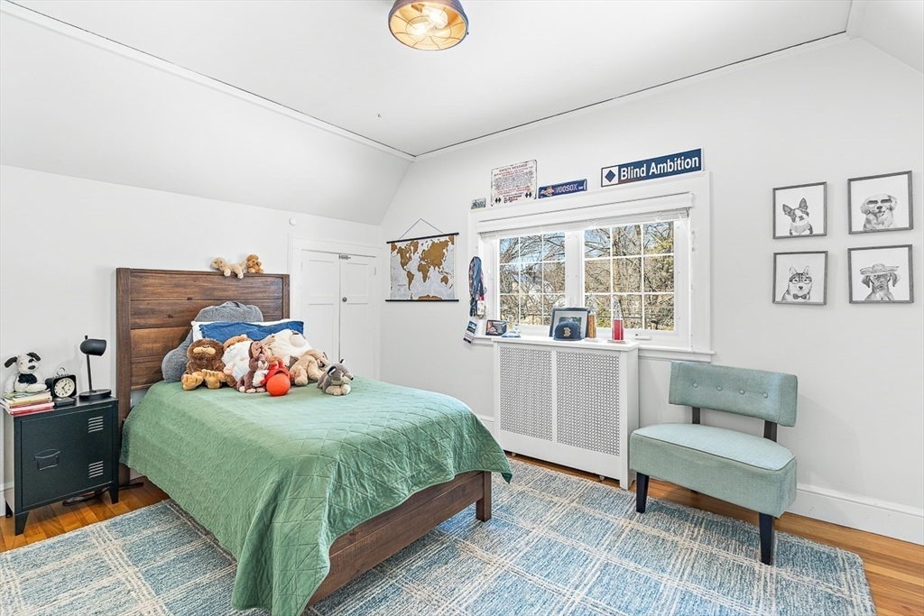 23 Jefferson Road Winchester, MA 01890 - Photo 26 of 41 a bedroom with a bed and a window