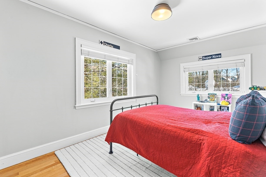 23 Jefferson Road Winchester, MA 01890 - Photo 27 of 41 a bedroom with a bed and a large window