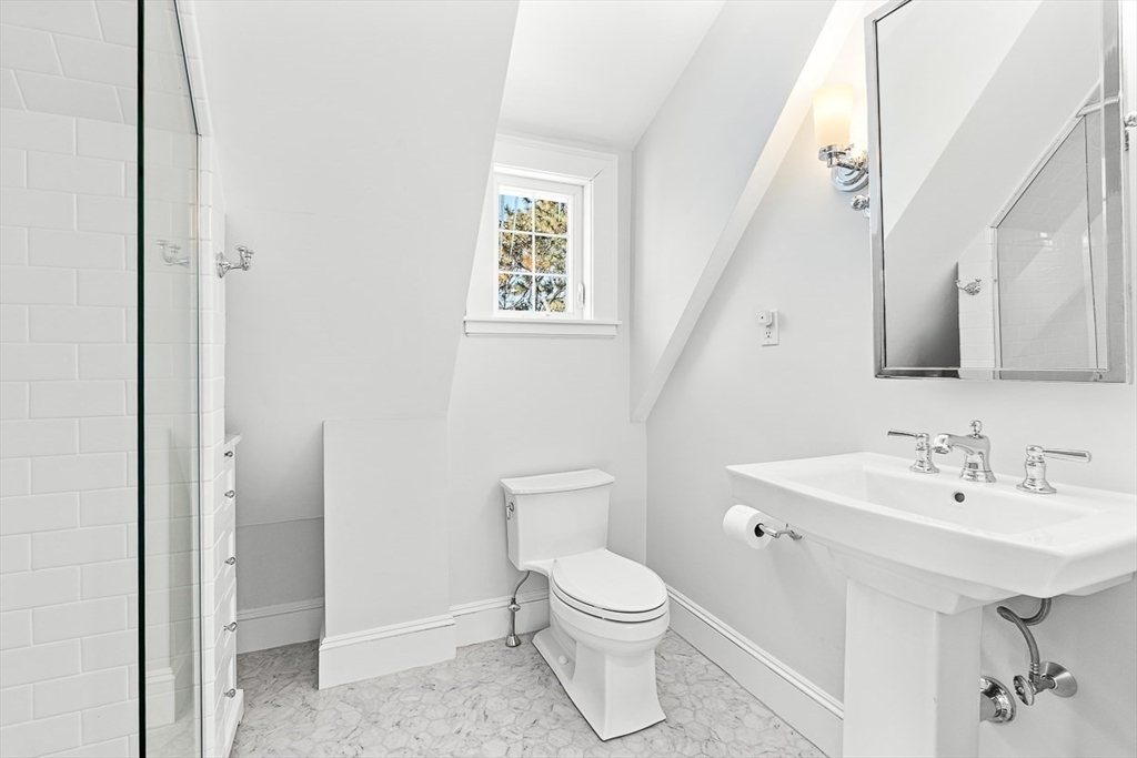 23 Jefferson Road Winchester, MA 01890 - Photo 31 of 41 a bathroom with a toilet a sink and a mirror