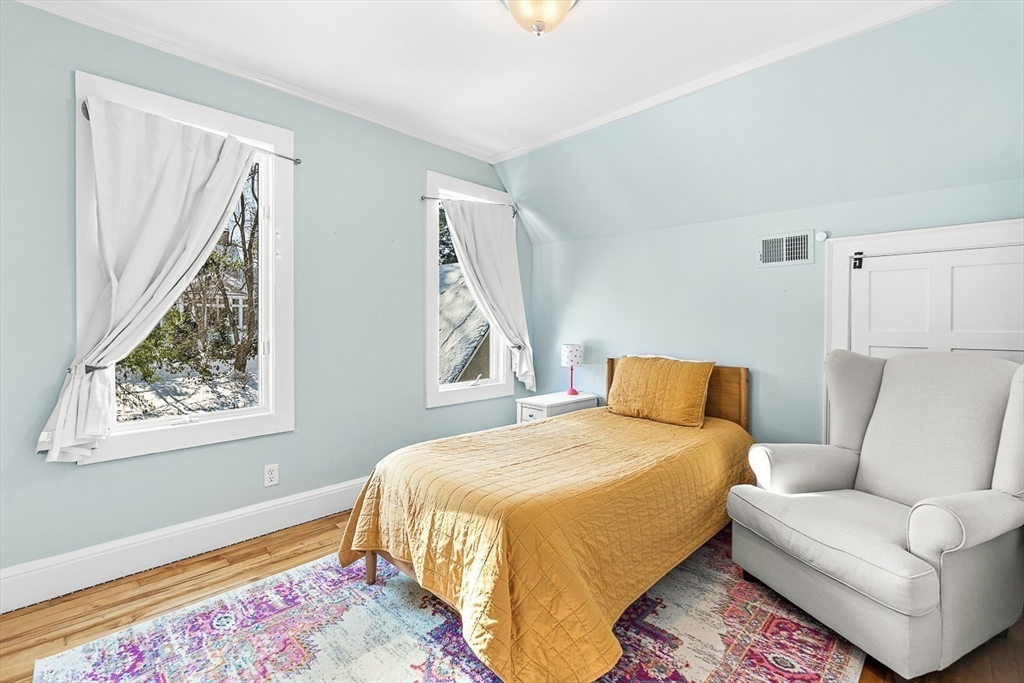 23 Jefferson Road Winchester, MA 01890 - Photo 32 of 41 a bedroom with a bed couch and a window