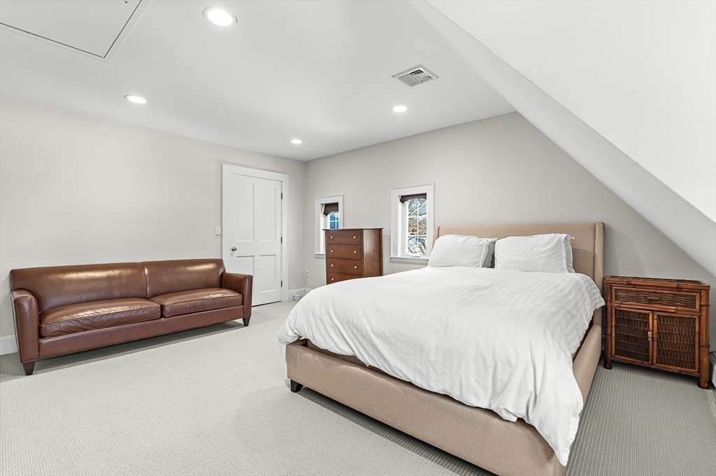 23 Jefferson Road Winchester, MA 01890 - Photo 34 of 41 a bedroom with a bed and a couch