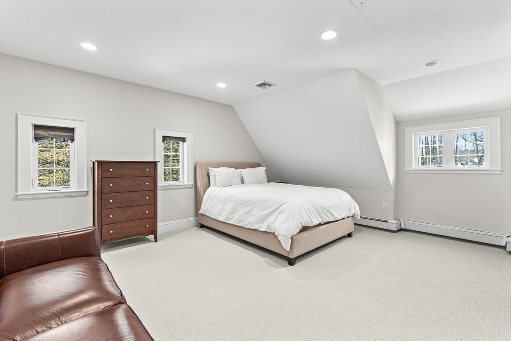 23 Jefferson Road Winchester, MA 01890 - Photo 36 of 41 a bedroom with a bed and a dresser