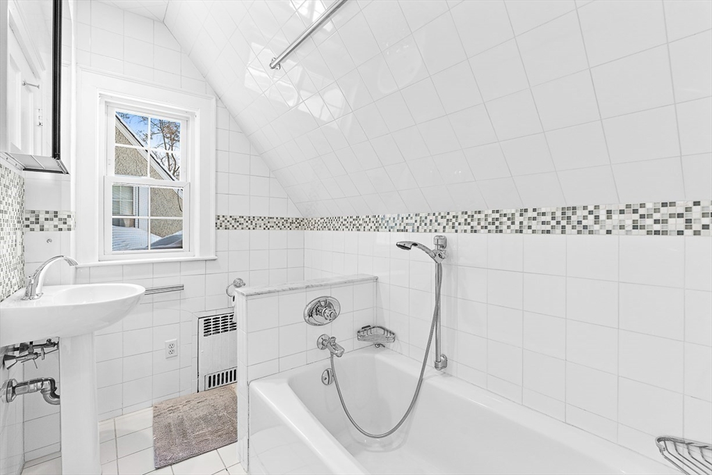 23 Jefferson Road Winchester, MA 01890 - Photo 38 of 41 a bathroom with a bath tub and a shower