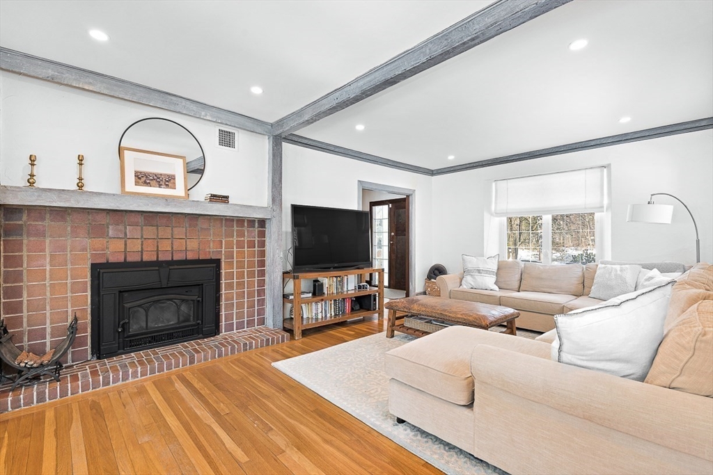 23 Jefferson Road Winchester, MA 01890 - Photo 5 of 41 a living room with furniture and a fireplace