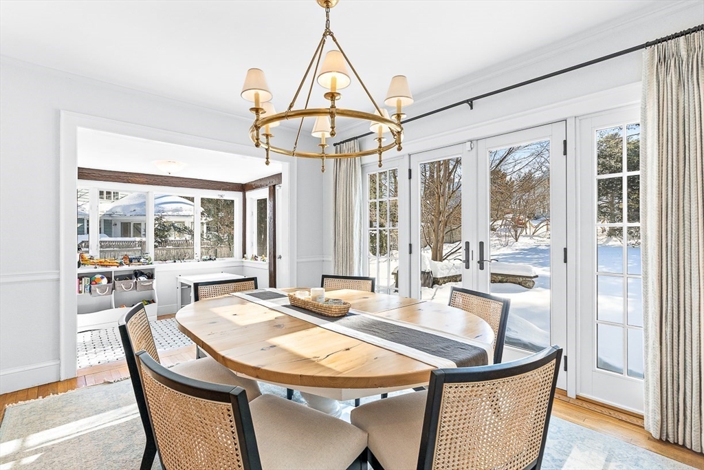 23 Jefferson Road Winchester, MA 01890 - Photo 6 of 41 a dining room with furniture a chandelier and wooden floor