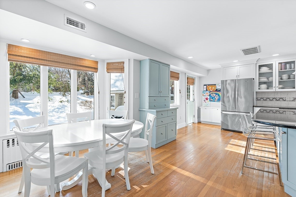 23 Jefferson Road Winchester, MA 01890 - Photo 8 of 41 a living room with furniture a large window and stainless steel appliances
