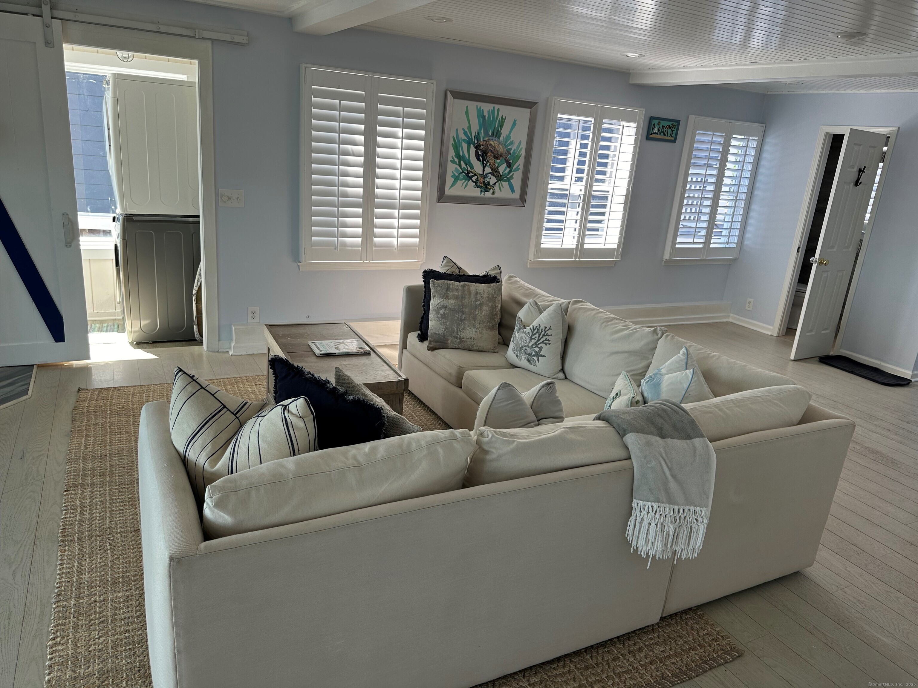 2149 Fairfield Beach Road Fairfield, CT 06824 - Photo 11 of 29 Great room with laundry and half bath