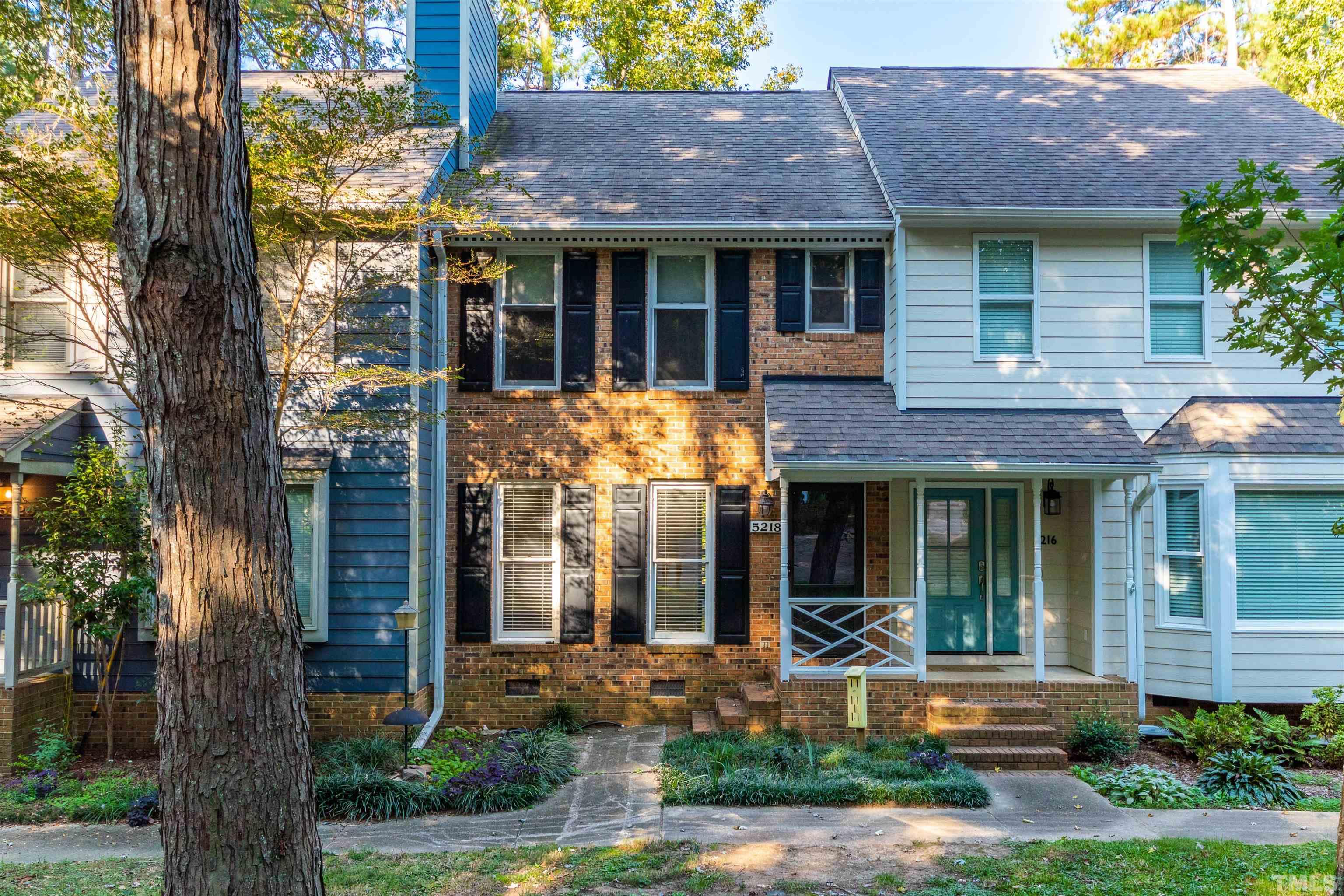 5218 Deer Haven Drive, Unit 5218 Raleigh, NC 27606 - Photo 1 of 27 front view of house with a yard