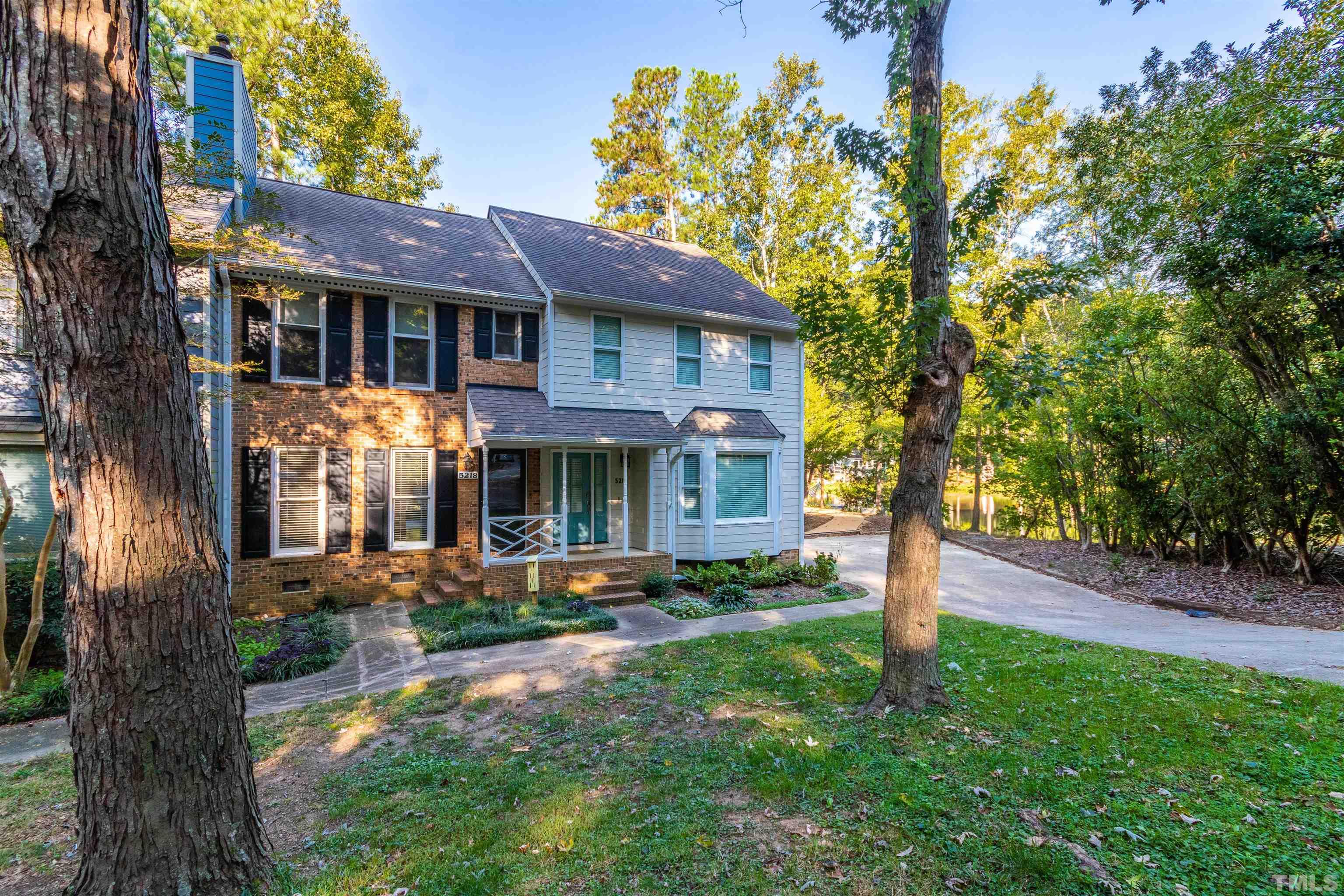 5218 Deer Haven Drive, Unit 5218 Raleigh, NC 27606 - Photo 3 of 27 a front view of a house with garden
