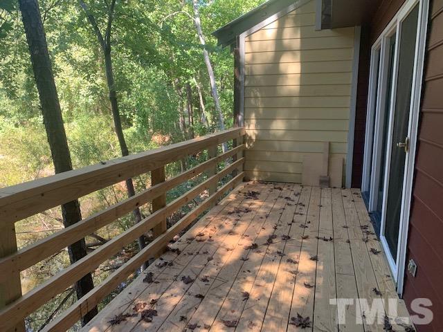 5218 Deer Haven Drive, Unit 5218 Raleigh, NC 27606 - Photo 26 of 27 a view of a balcony with wooden floor