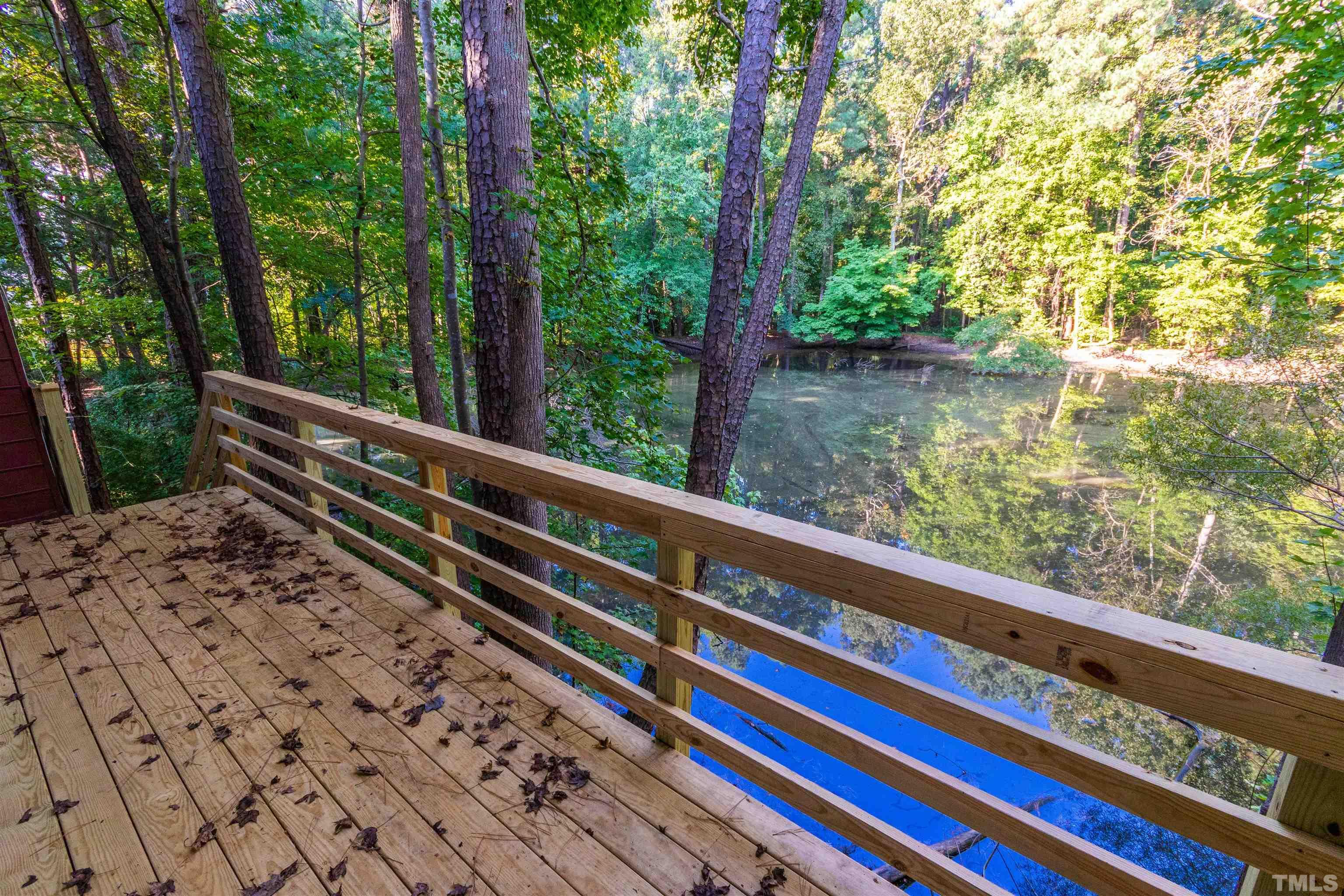 5218 Deer Haven Drive, Unit 5218 Raleigh, NC 27606 - Photo 27 of 27 a view of balcony with wooden floor and fence