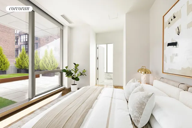 a spacious bathroom with a tub sink and mirror