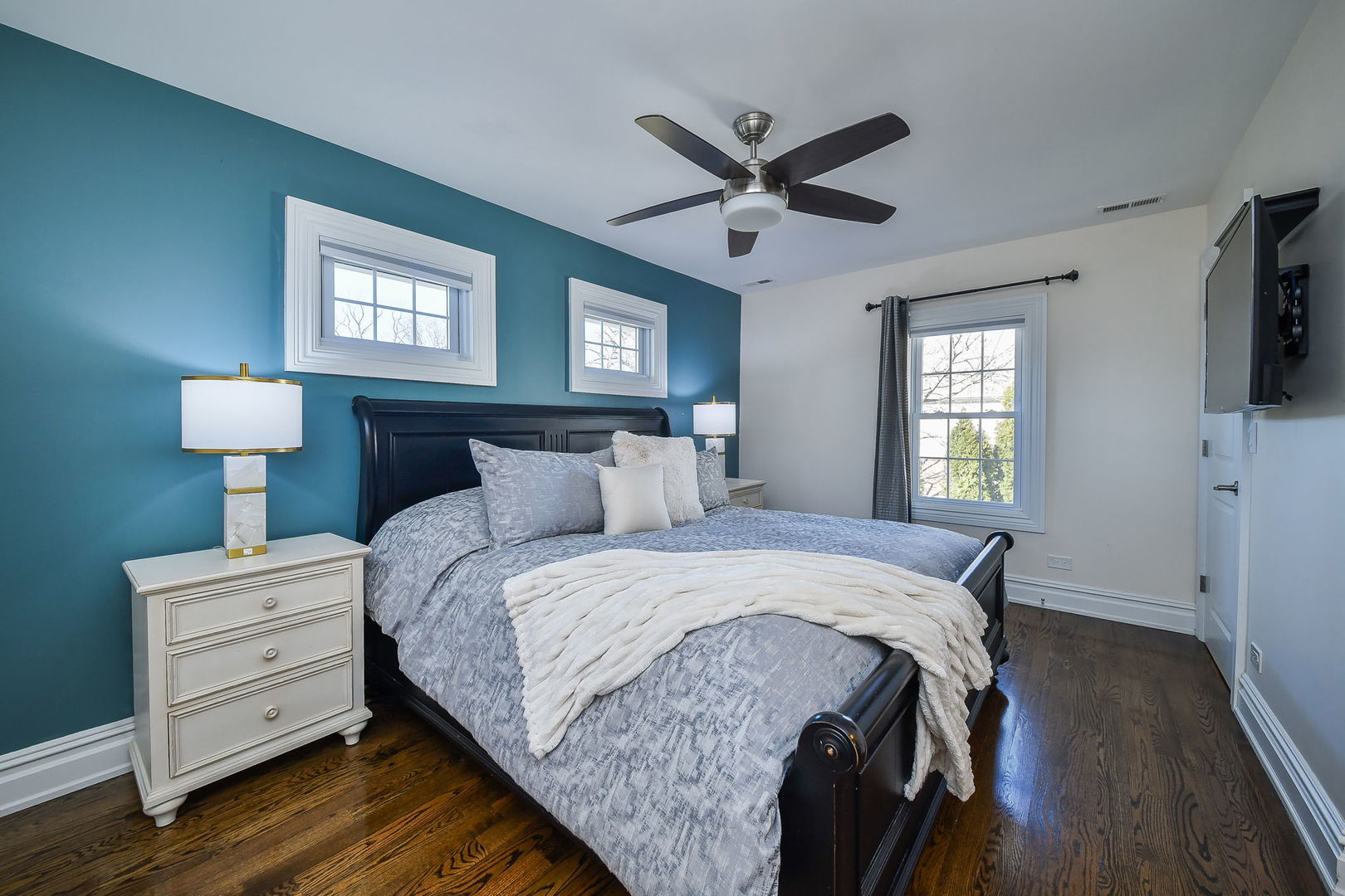 325 North Wright Street Naperville, IL 60540 - Photo 22 of 53 a bed room with a bed a mirror and a window