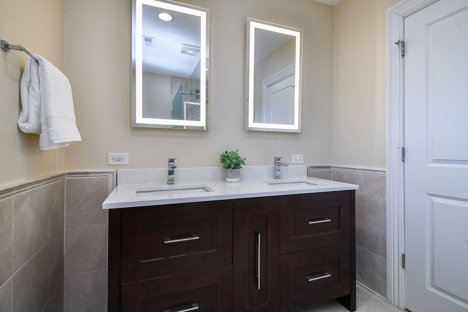 325 North Wright Street Naperville, IL 60540 - Photo 24 of 53 a bathroom with a sink vanity and mirror