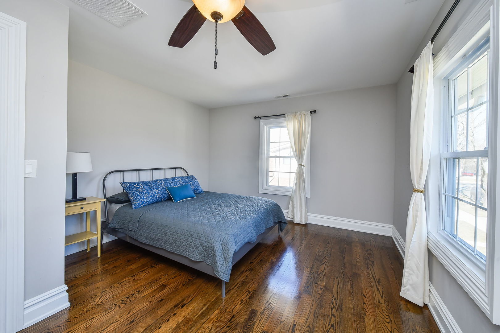 325 North Wright Street Naperville, IL 60540 - Photo 25 of 53 a bedroom with a bed and wooden floor
