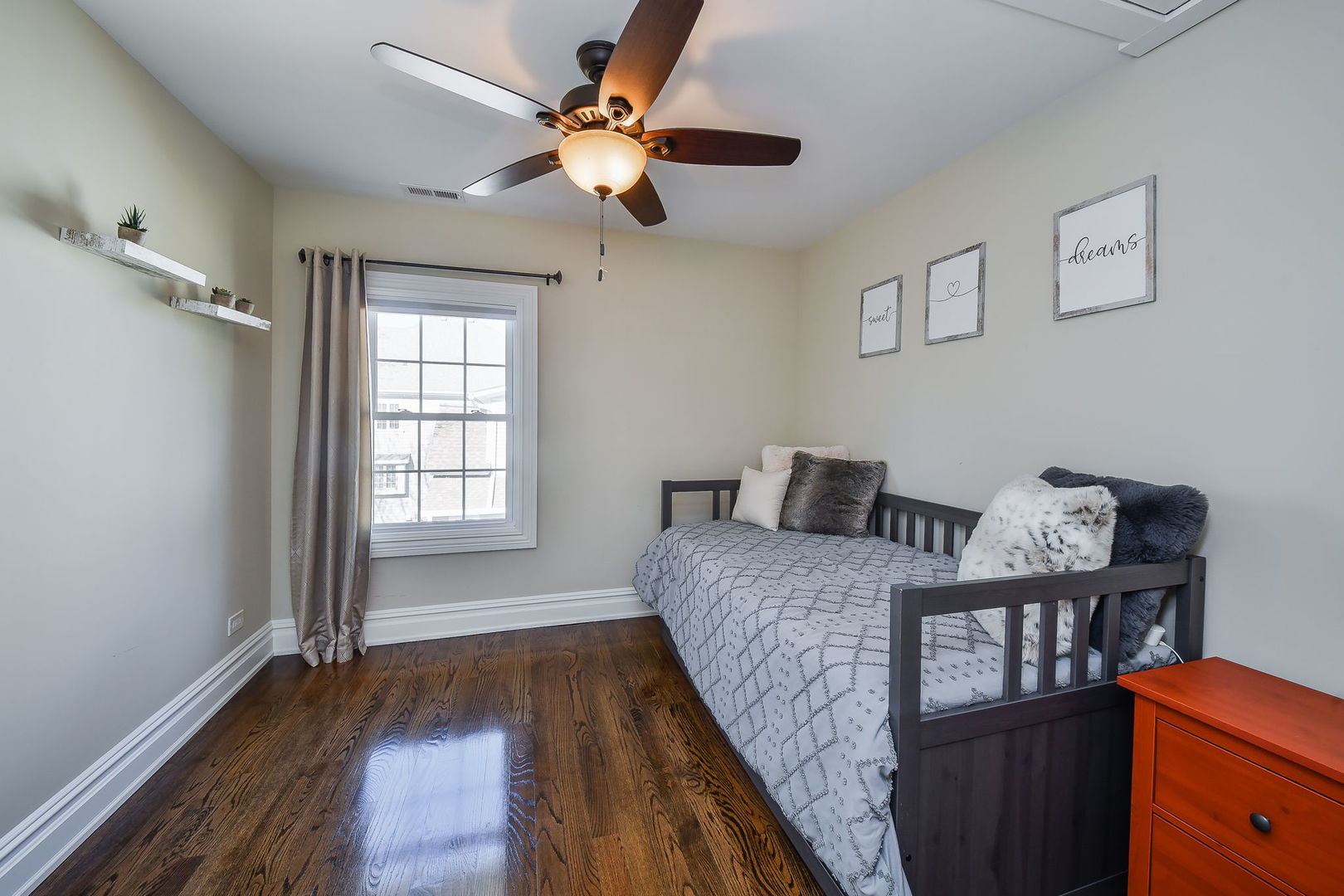 325 North Wright Street Naperville, IL 60540 - Photo 27 of 53 a bedroom with a bed and a chandelier