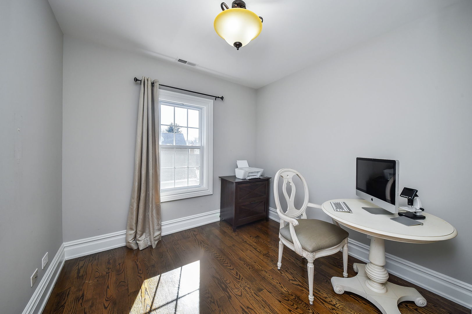 325 North Wright Street Naperville, IL 60540 - Photo 28 of 53 a view of a workspace with furniture and a window